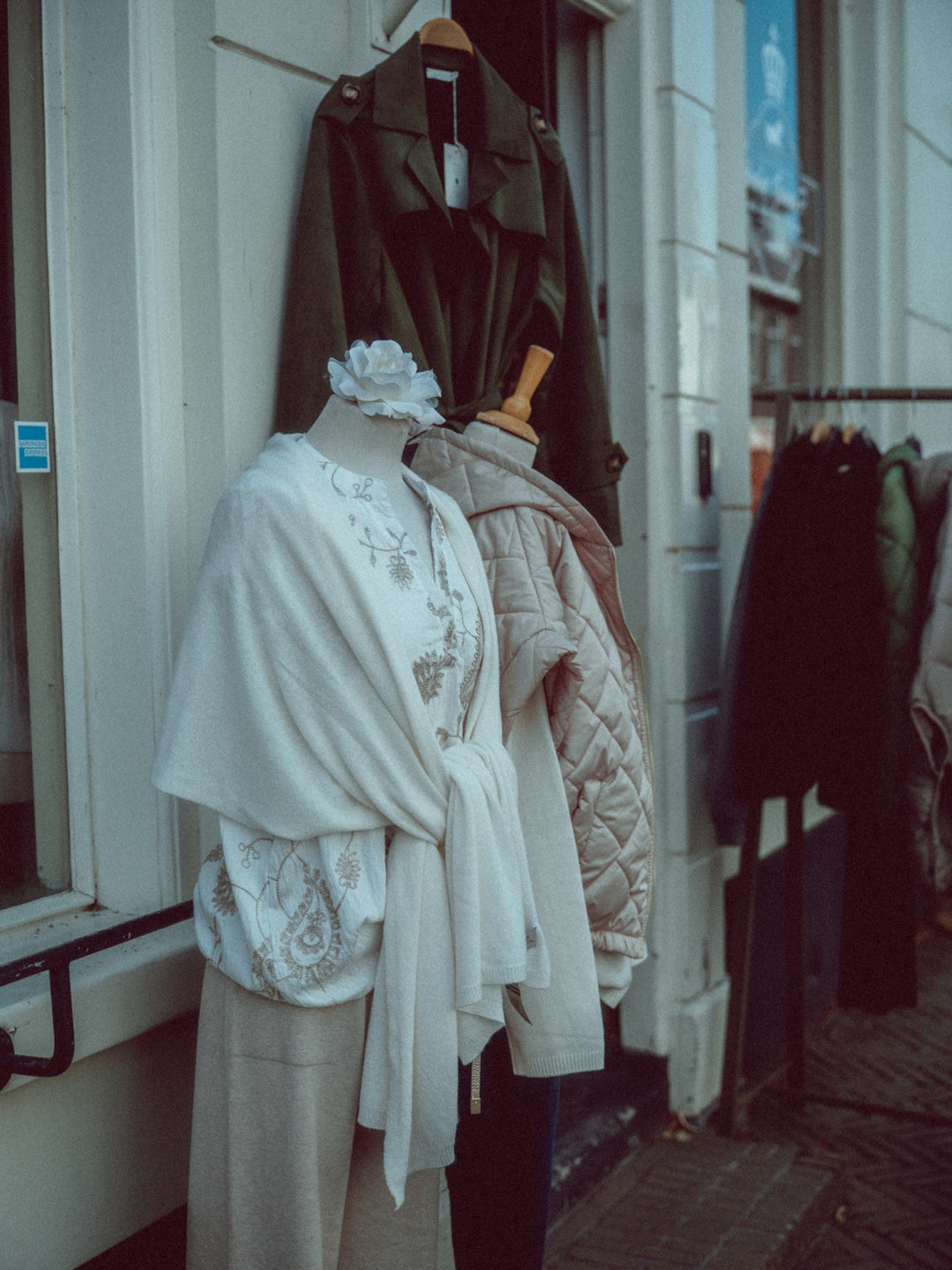 Mannequins displaying clothing outside a store