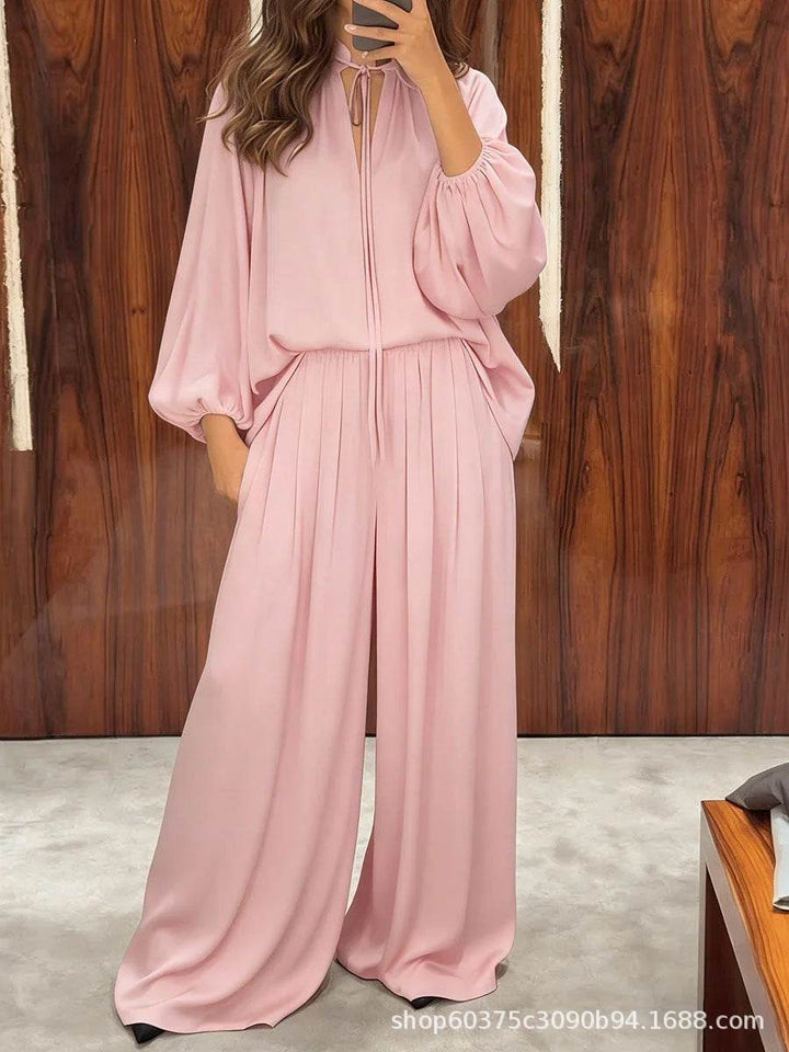 Eleganter rosa Jumpsuit mit weiten Hosenbeinen und Puffärmeln, geschnürtes Dekolleté, IsabellBoutique030.