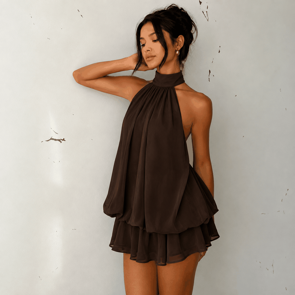 Sommerliches Neckholder-Kleid in gelb mit raffiniertem A-Linien-Schnitt und rückenfreiem Design, perfekt für Strand und Urlaub