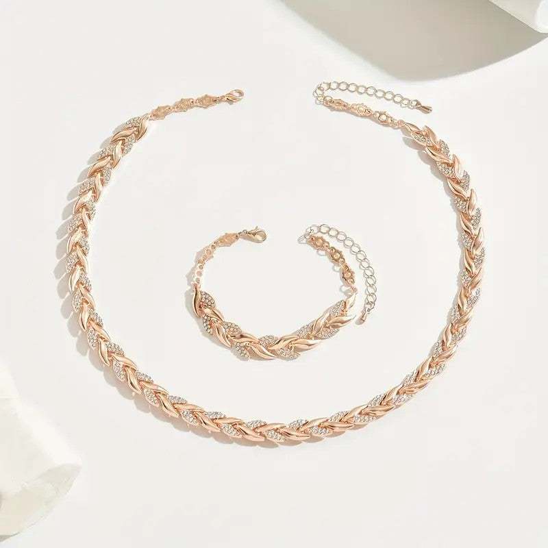 Goldfarbener Schmuck-Set mit Zirkonia-Steinen, Blattmotiv und Gliederkette, Collier und Armband. IsabellBoutique030