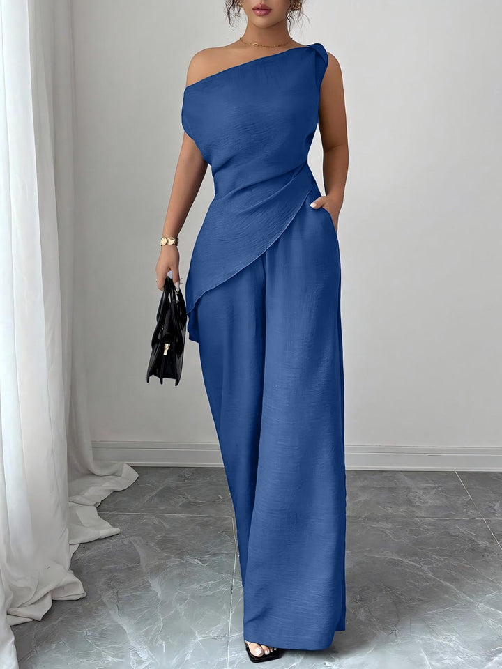 Blauer One-Shoulder-Jumpsuit mit weiten Hosen und asymmetrischem Überwurf IsabellBoutique030