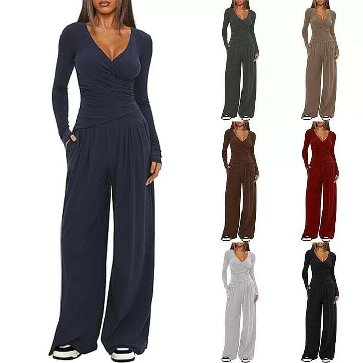 Dunkelblauer Wickel-Jumpsuit mit weiten Beinen und langen Ärmeln, bequem und elegant. IsabellBoutique030