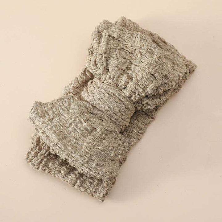 Beiges elastisches Kinder-Haarband mit großer karierter Schleife