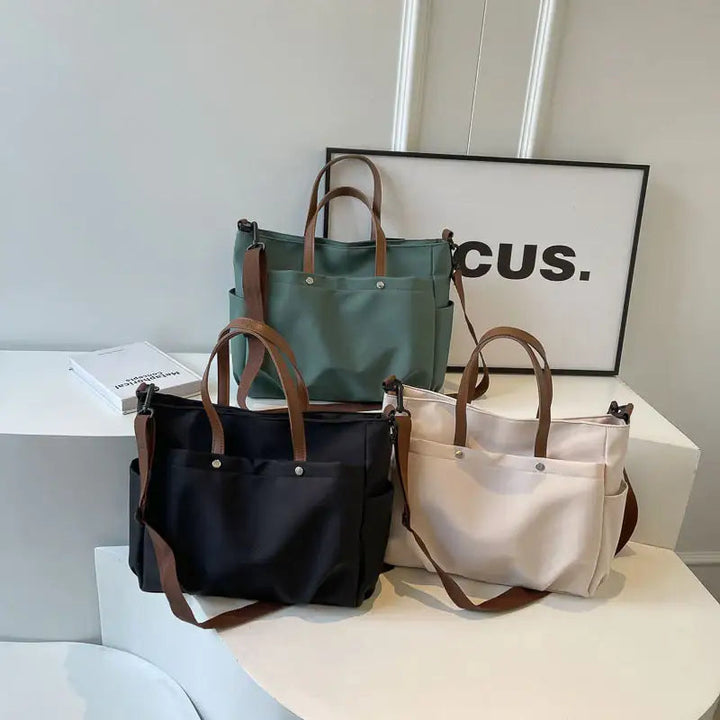 Modische lässige schlichte Schultertasche mit großem Fassungsvermögen und offener Außentasche in mehreren Farben