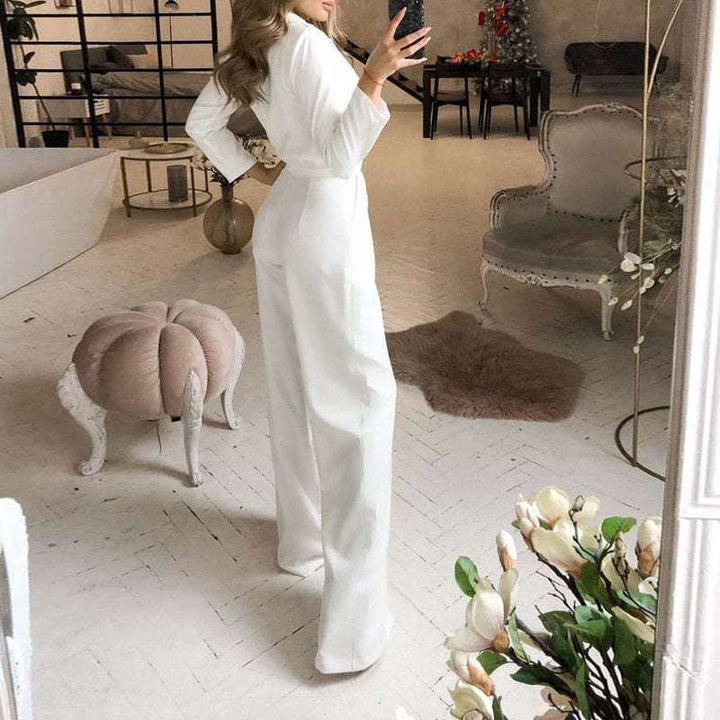 Elegantes weißes Hosenkleid mit weitem Bein und langem Ärmel, schick und modern. IsabellBoutique030
