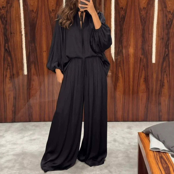 Schwarzer eleganter Jumpsuit mit weiten Hosenbeinen und Ballonärmeln, V-Ausschnitt mit Band, IsabellBoutique030
